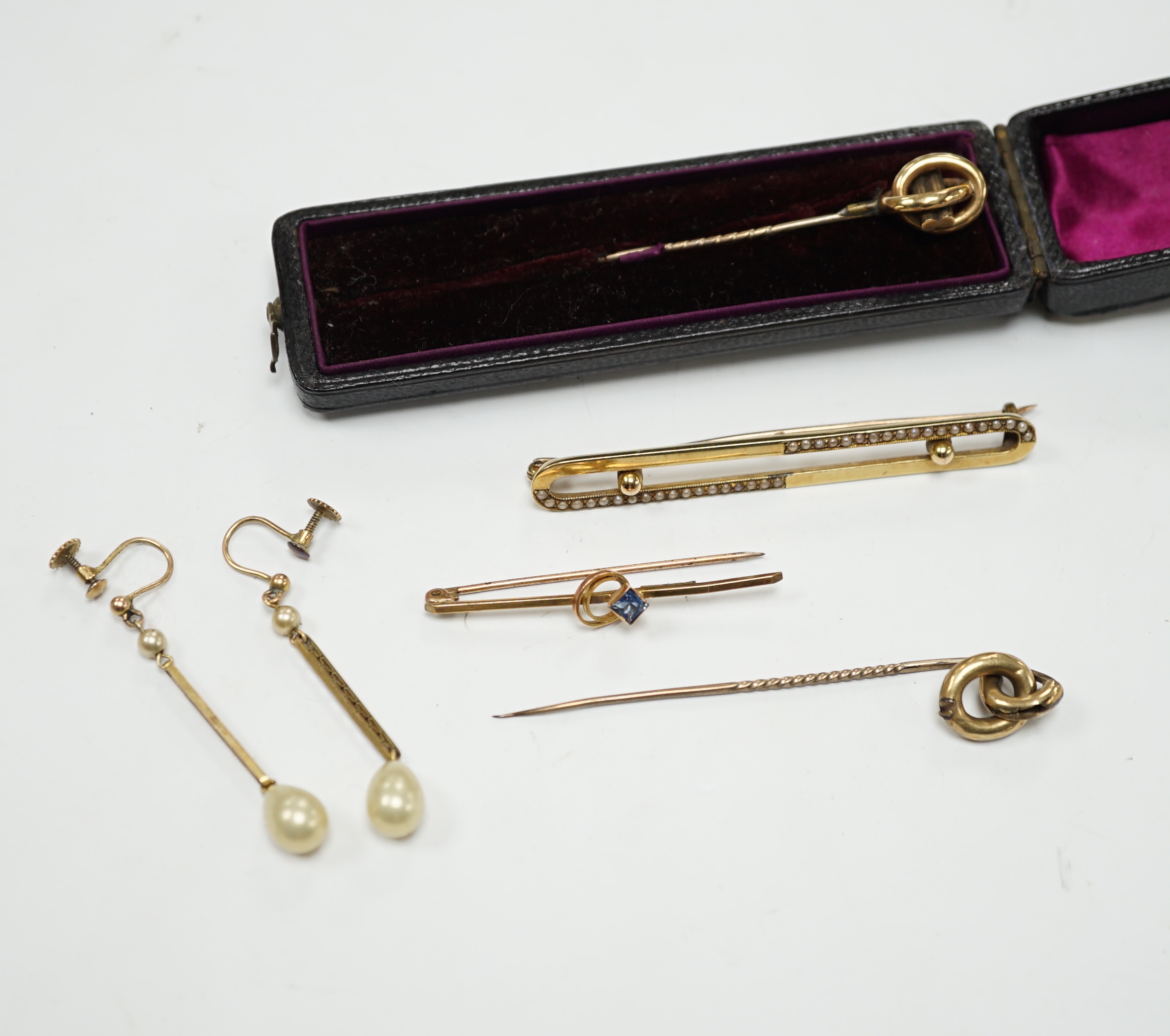 An Edwardian 15ct and seed pearl set bar brooch, 64mm, gross 4.9 grams, a 9ct bar brooch, two stick pins and a pair of 9ct and simulated pearl set drop earrings.